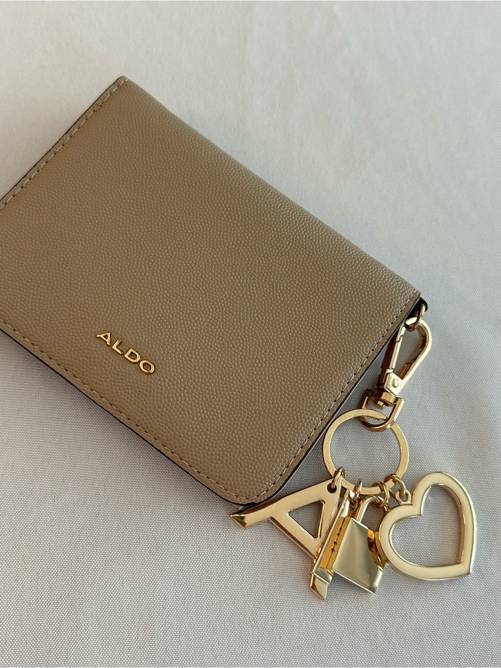 ALDO taupe card & charm key holder with gold accents